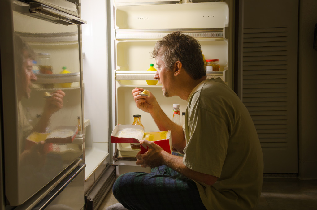 binge eating infront of fridge