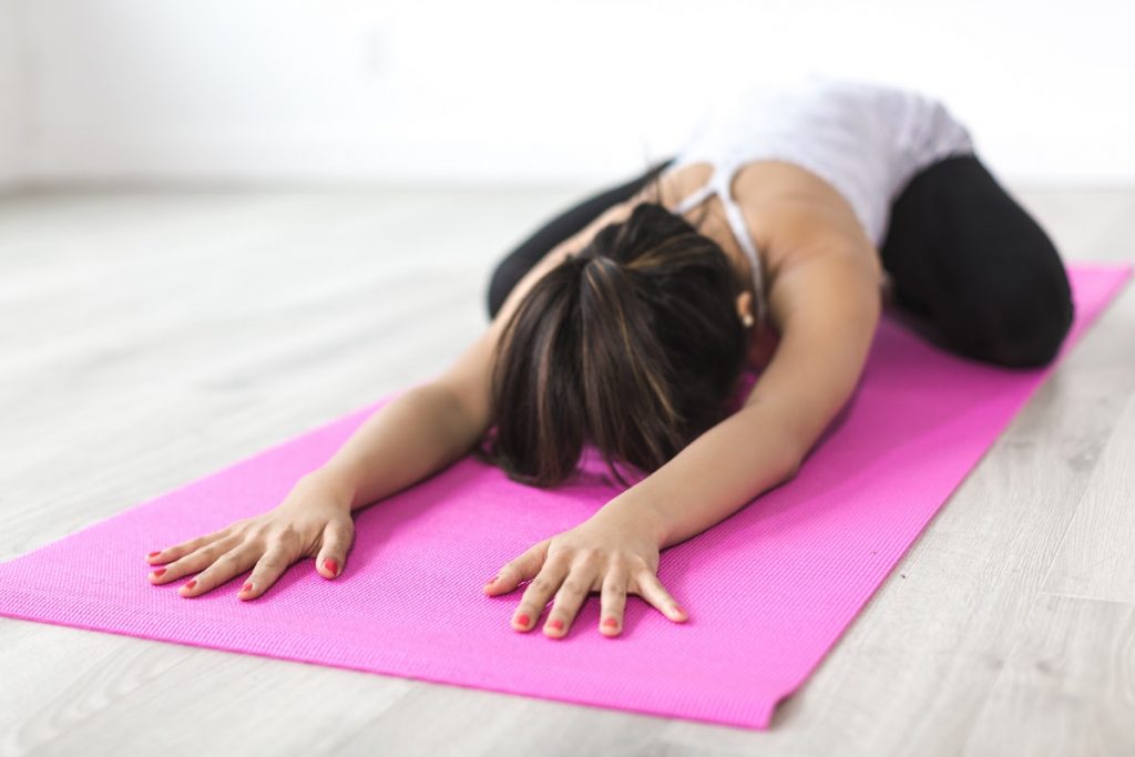 woman stretching yoga