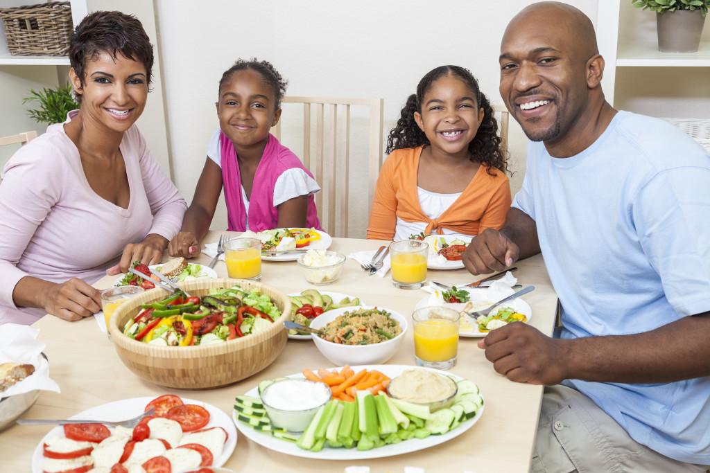 a black family having a healthy meal