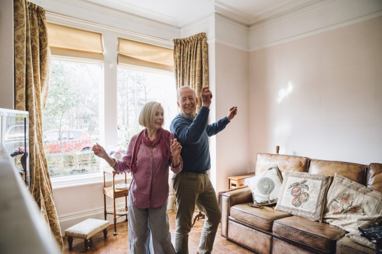 seniors dancing in a living room