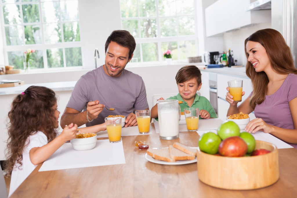 happy family eating healthy breakfast