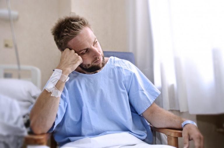 sad young man in wheelchair